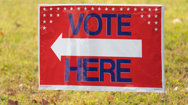 A sign is posted as voters turn out to cast their ballots as early voting begins on October 17, 2022 in Atlanta, Georgia. 
