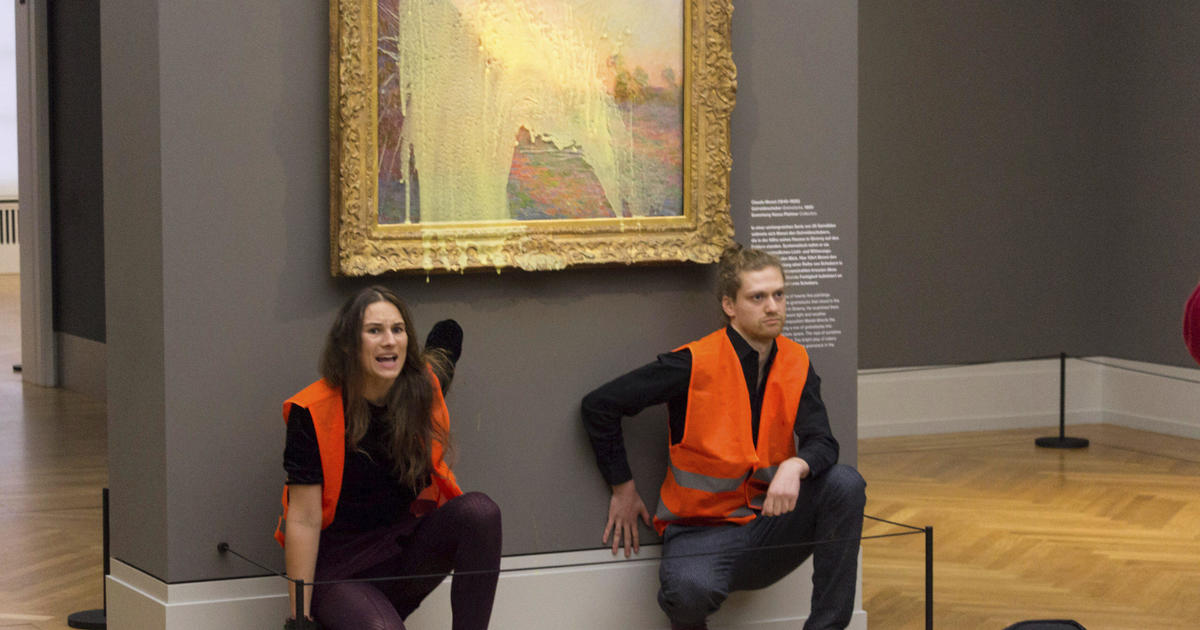 Climate activists throw mashed potatoes on Monet painting to protest fossil fuel extraction