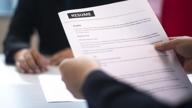 Recruitment, Job application, contract and business employment concept. Hand giving the resume to the recruiter to review the profile of the applicant. 