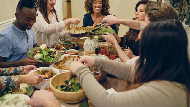 Friends Celebrating Thanksgiving Dinner Together 