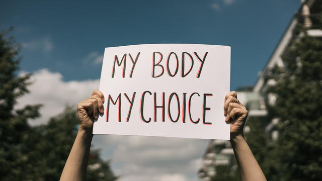 A sign reads "My Body, My Choice." 