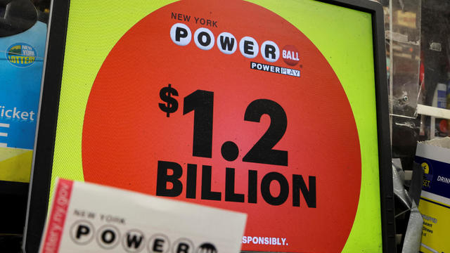 A screen advertises the Powerball jackpot of $1.2 billion in a store in Brooklyn, New York, November 2, 2022. 