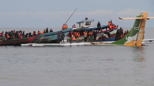 Rescuers attempt to recover the Precision Air passenger plane that crashed into Lake Victoria in Bukoba 