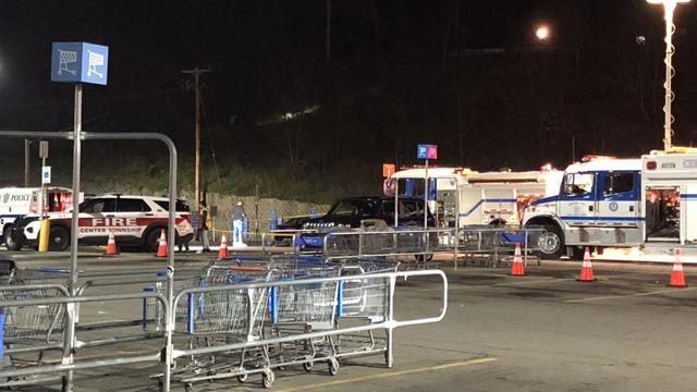 Two police officers behind crime scene tape 