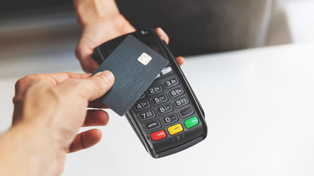 nfc contactless payment by credit card and pos terminal. copy space 