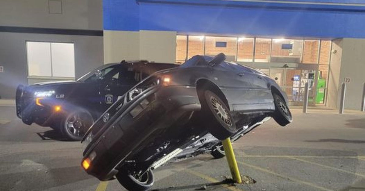 'Not a legal parking spot': Car ends up on top of pole in Leicester ...