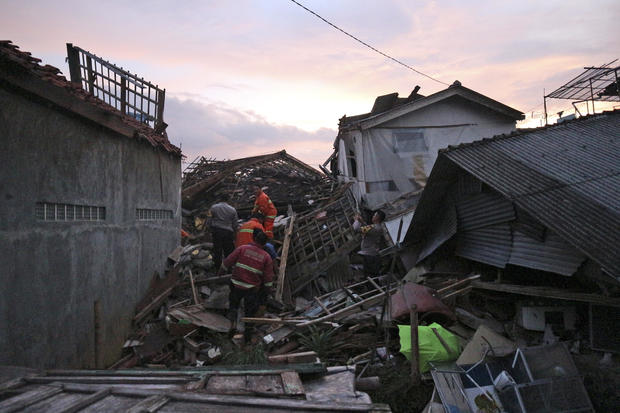 Rescuers search for survivors among the ruins of houses damaged by an earthquake in Cianjur, West Java, Indonesia