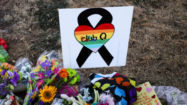 Floral tributes are placed in memory of the victims after a mass shooting at the Club Q nightclub in Colorado Springs, Colorado, November 20, 2022. 