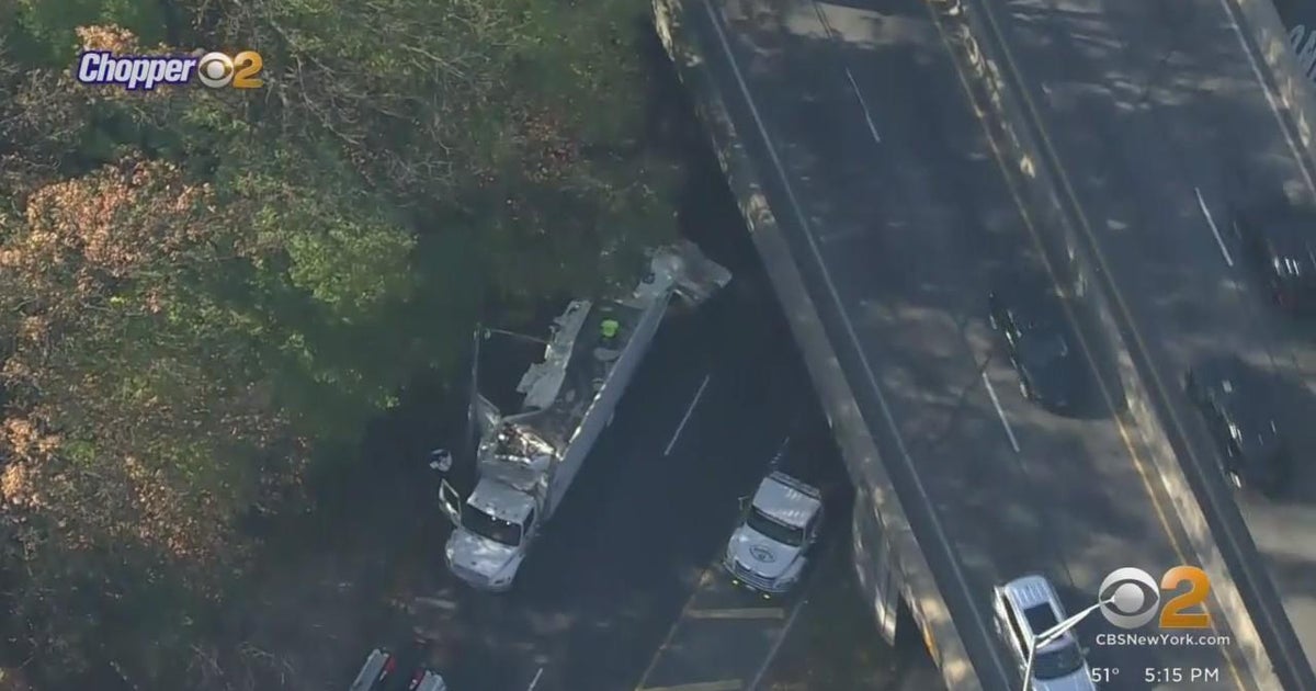 Tractor trailer hits overpass in Queens, roof sheared off - CBS New York