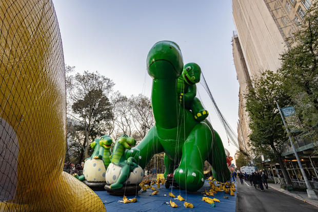 Sinclair's Dino balloon is inflated ahead of the Macy's Thanksgiving Day Parade on November 23, 2022 in New York City. 