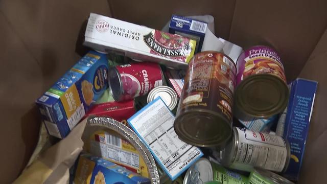 A box full of donated nonperishable food items. 