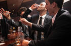 Businesspeople drinking at a bar 