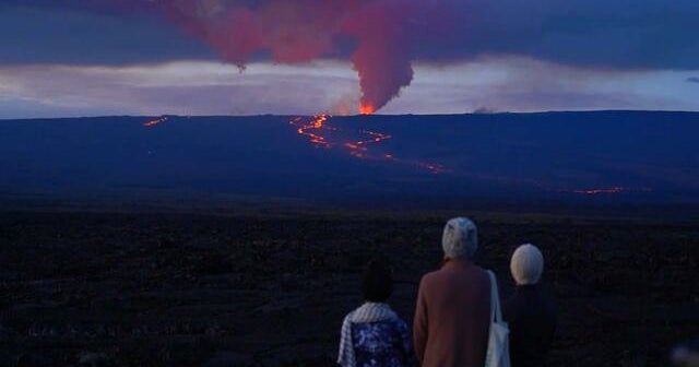 Viewers flock to watch fountains of glowing lava spew from the world’s largest volcano