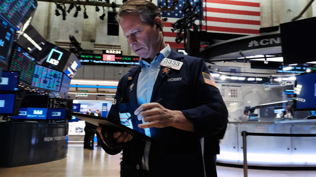 Trader on the floor of New York Stock Exchange 