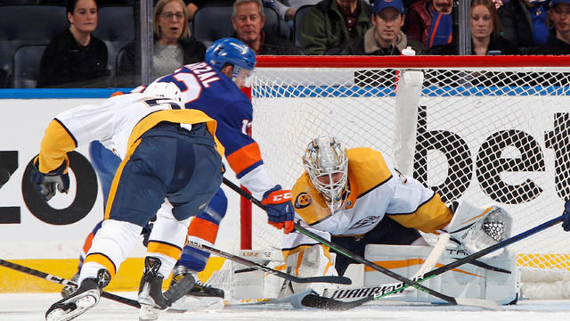 Kevin Lankinen #32 of the Nashville Predators makes the third period save on Mathew Barzal #13 of the New York Islanders at the UBS Arena on December 02, 2022 in Elmont, New York. 