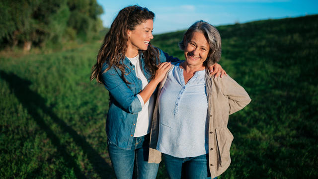 Caucasian mother and daughter celebrating mother's day in nature 