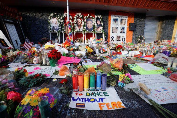 Flowers, candles and mementos are left at a memorial after a mass shooting at LGBTQ nightclub Club Q in Colorado Springs, Colorado, November 26, 2022. 