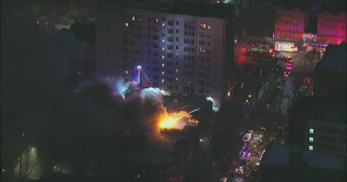 8 residents displaced, woman in critical condition after apartment fire