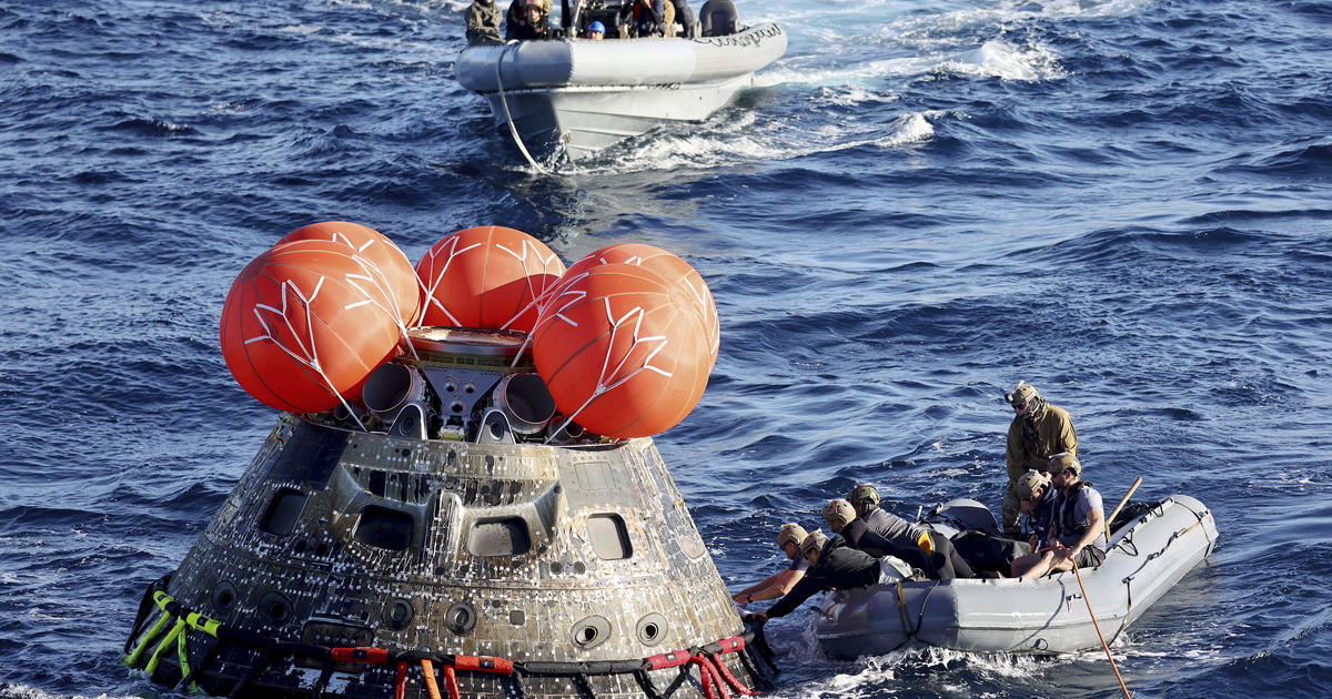 NASA Orion capsule safely blazes back from moon, aces exam