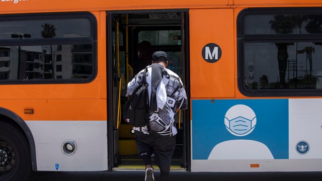 A man boards a METRO bus 