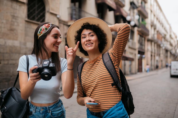 Happy heterosexual lesbian couple on vacation together 