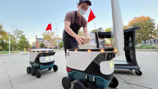 A robot delivery service via a robot. 