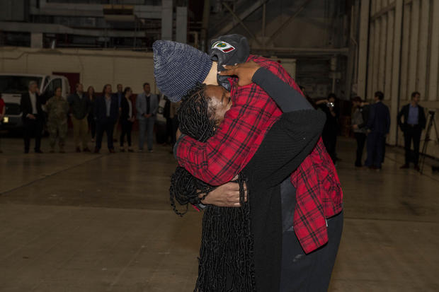 Brittney Griner embraces her wife Cherelle after landing back in the U.S. from Russia. 