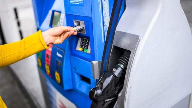 Paying for fuel using a credit card at a gas station 