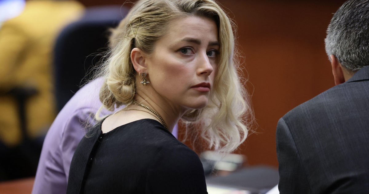 Amber Heard says she's settling Johnny Depp's defamation suit