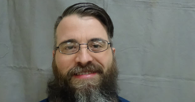 Man charged with killing County prison inmate, stabbing another