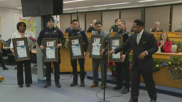 Aurora police officer Andrew Soderlund and 9-year-old Tyshaun LaFlore 