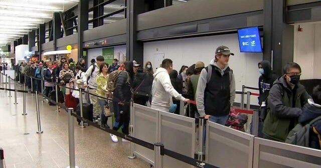 Travel chaos continues as winter storms sweeps across country - CBS News