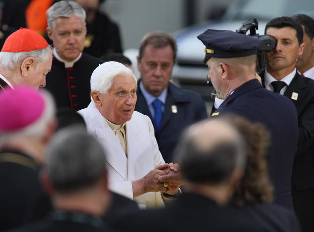 Pope Benedict XVI greets a police office 
