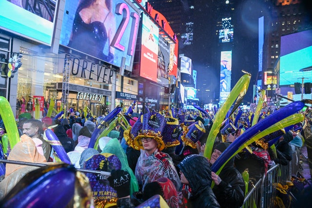 Revelers celebrate New Year's Eve in Times Square in the rain on December 31, 2022 in New York City. 