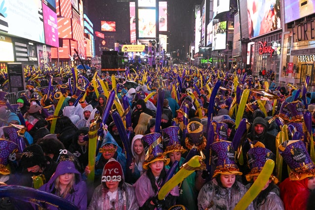 Revelers celebrate New Year's Eve in Times Square in the rain on December 31, 2022 in New York City. 