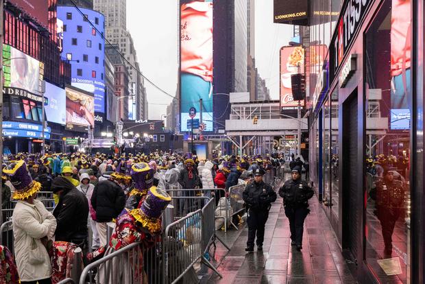 People gather to celebrate the new year and await the ball drop in Times Square, New York City, on December 31, 2022. 