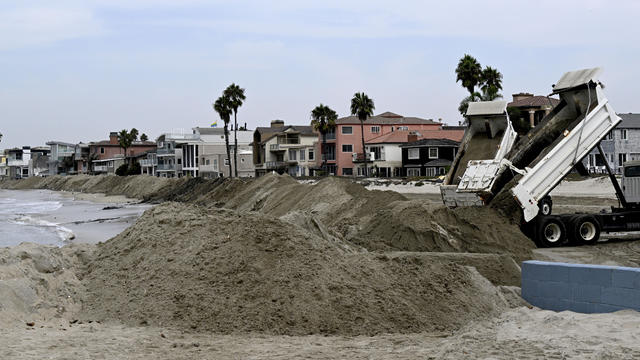 Coastal cities deal with high tides, appraoching rains and possible flooding. 