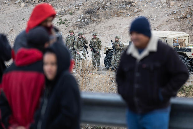 Texas National Guard soldiers stand guard at the U.S.-Mexico border on Jan. 7, 2023, as viewed from Ciudad Juarez, Mexico. 