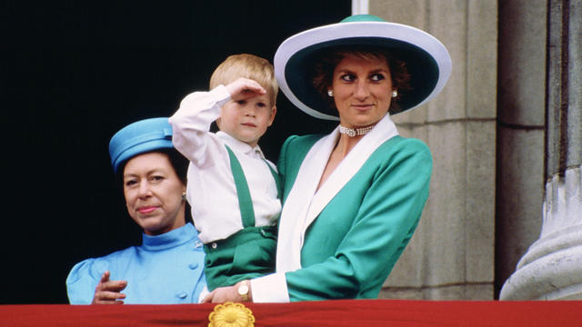 Diana, Princess of Wales, holding a young Prince Harry in he 