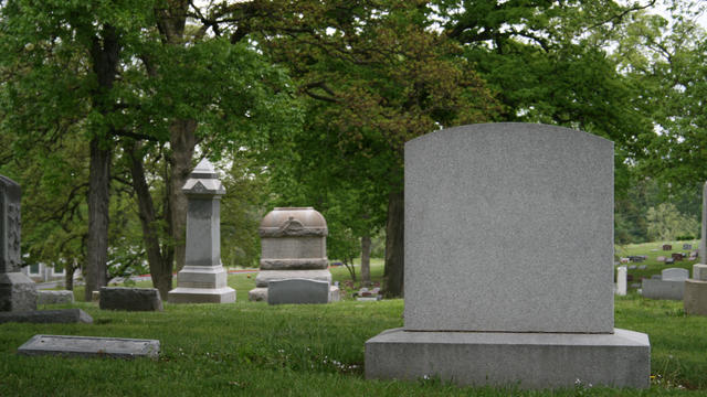 A cemetery and tombstone in the daylight 