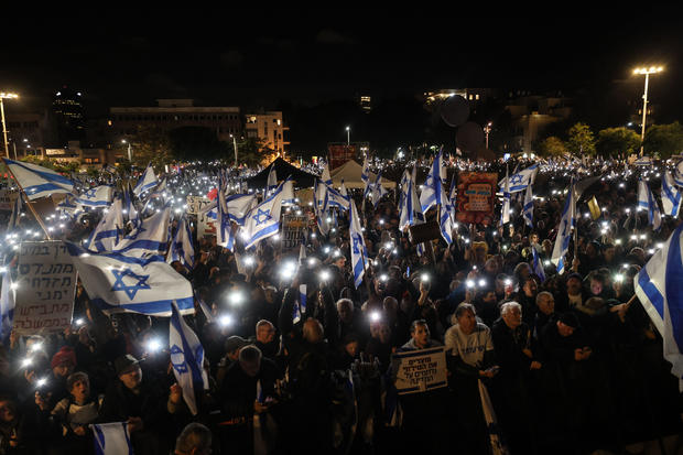 People gather to stage a protest against Israeli Prime Minister Benjamin Netanyahu's government at Habima Square in Tel Aviv, Israel, January 14, 2023