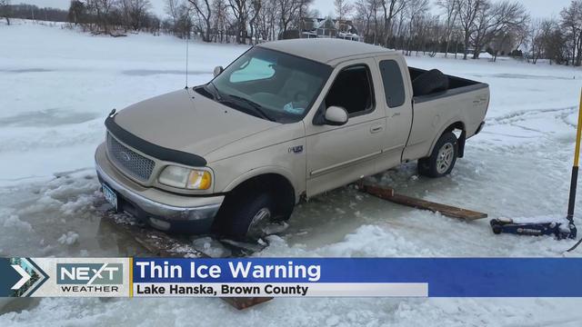 Truck breaks through thin ice