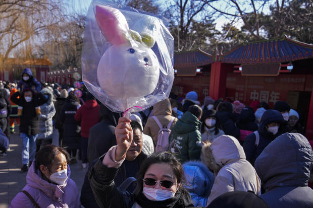 China's COVID surge cast a shadow over Lunar New Year travel rush, but there are signs of hope
