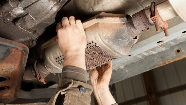 Catalytic Converter Removal at a Salvage Yard 