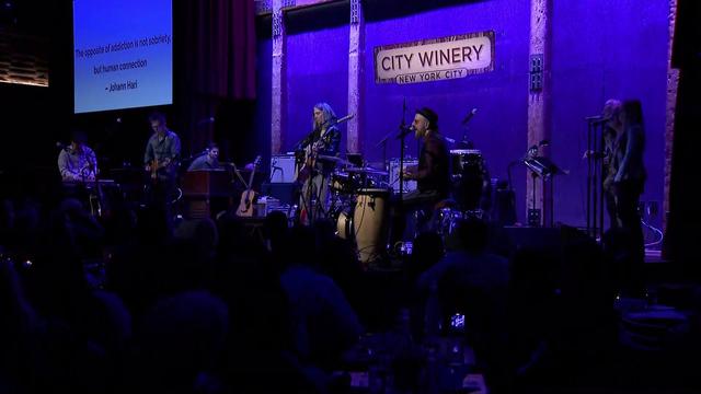 Musicians perform on stage in front of a crowd at City Winery. 