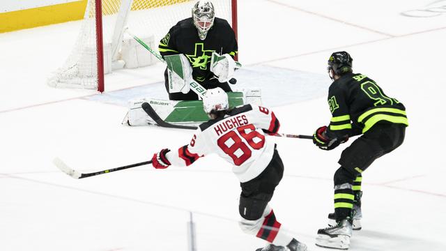 Jack Hughes #86 of the New Jersey Devils scores a goal during overtime against the Dallas Stars at American Airlines Center on January 27, 2023 in Dallas, Texas. 