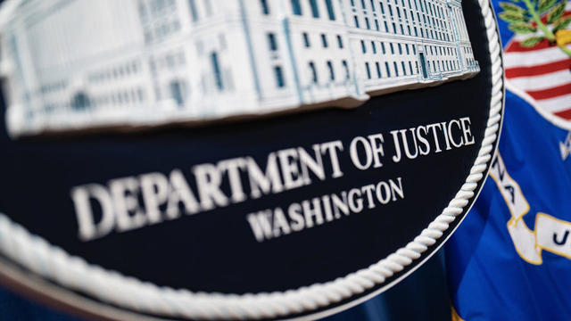 Seal of the U.S> Department of Justice before a news conference in Washington, D.C., on Tuesday, Jan. 24, 2023. 