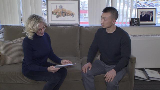 CBS2's Jennifer McLogan sits on a couch with Baimadajie Angwang. 