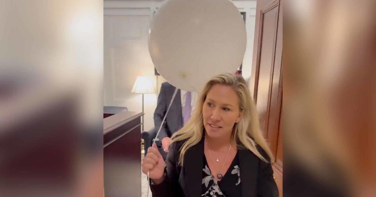 Rep. Marjorie Taylor Greene carried a white balloon ahead of the State of the Union - CBS News