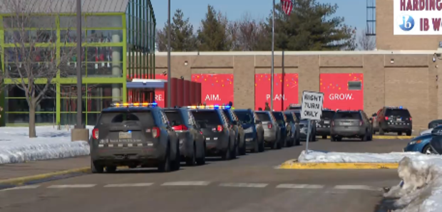 A picture of multiple police cars outside Harding High School in St. Paul, Minnesota. 
